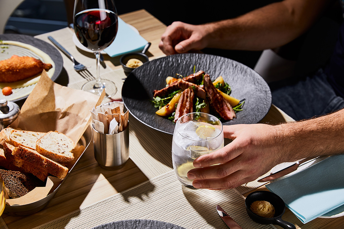 Elegant lunch with steak salad and red wine